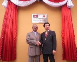 H.E. Sar Kheng and H.E. AKIBA Kenya in front of the commemorative plaque