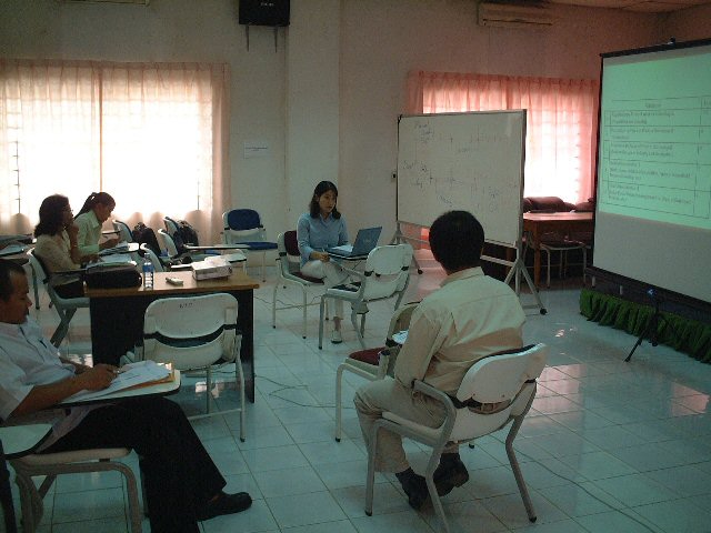 Photo 1. Delivering a lecture to NIS staffs by JICA Expert, the officer of National Statistics Center, Japan.