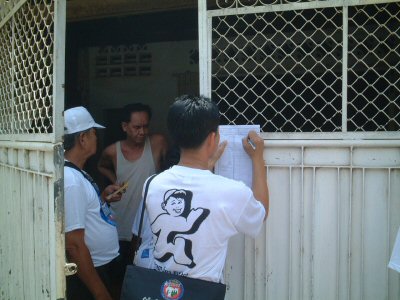 Photo 2. Enumerator is filling in Household List in Phnom Penh.