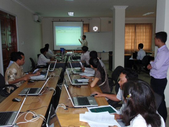 Photo 1. JICA Expert, the officer of the National Statistics Center, assists a lecture on EXCEL VBA to line ministries.