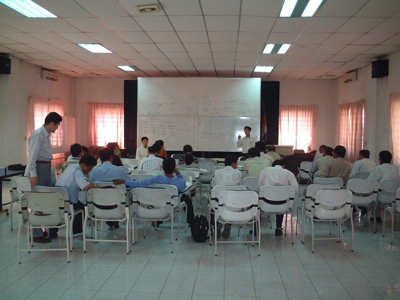 Photo 1. Explaining how to conduct Establishment Listing to enumerators. 