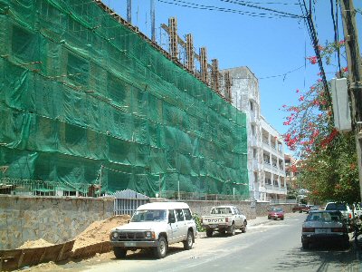 Photo 1. The shell of the fifth floor of six-story building is under construction.