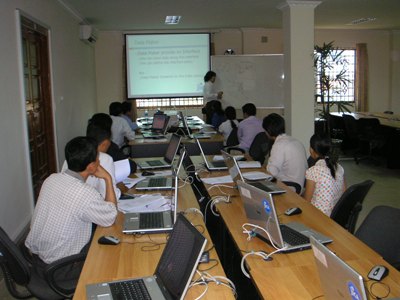 Photo 1. JICA Expert, the officer of the National Statistics Center, delivers a lecture on EXCEL VBA to NIS staff.