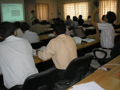 Photo 1. Delivering a lecture to NIS staffs by JICA Expert, the officer of Statistical Research and Training Institute of Japan.